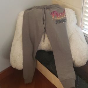 Pink sweatpants with multi color logo